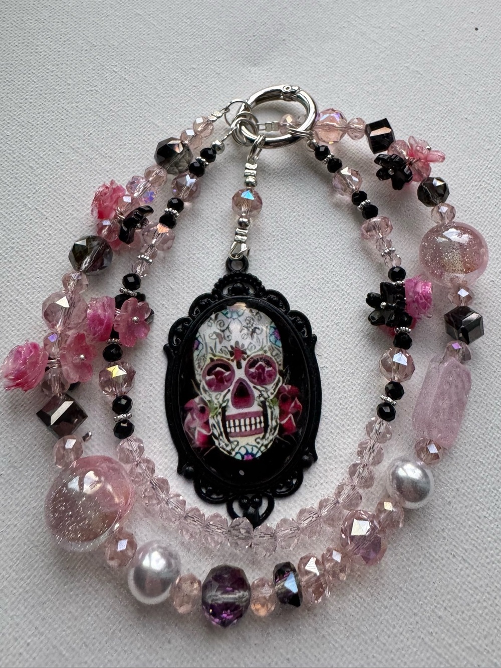 Pink Sugar Skull Multi-Strand phone charm.